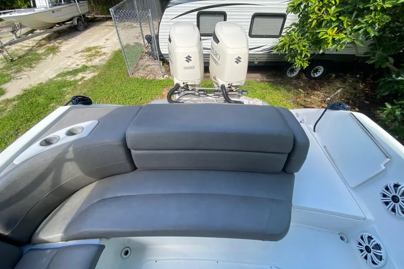 Slide: The Image of 2005 Formula 280 Sun Sport boat with Suzuki 300 engines, featuring gray seating and cup holders. - 26