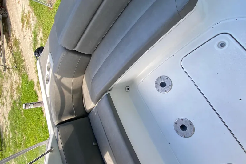 Slide: The Image of 2005 Formula 280 Sun Sport boat interior with gray seating and white deck. - 27