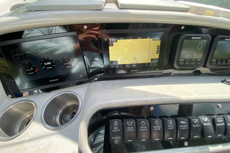 Slide: The Image of Dashboard of a 2005 Formula 280 Sun Sport with Garmin navigation displays. - 33