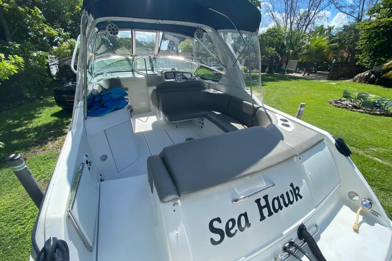 Slide: The Image of 2005 Formula 280 Sun Sport boat "Sea Hawk" docked on grassy area. - 35