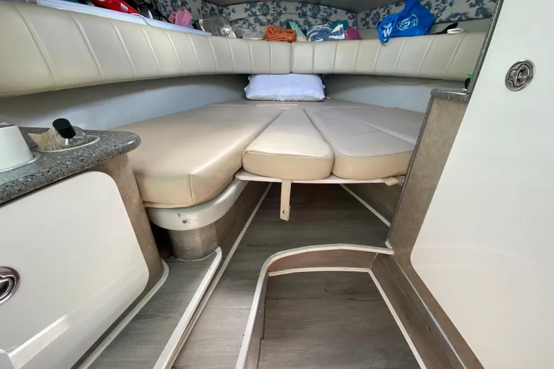 Slide: The Image of Interior cabin of a 2005 Formula 280 Sun Sport boat with beige seating. - 36