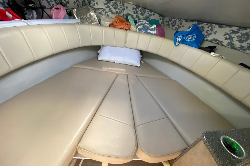 Slide: The Image of Interior cabin of 2005 Formula 280 Sun Sport boat with beige seating and storage. - 37