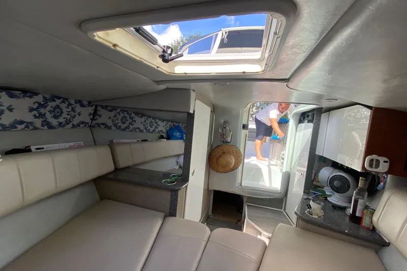 Slide: The Image of Interior of a 2005 Formula 280 Sun Sport boat with seating and a person outside. - 41
