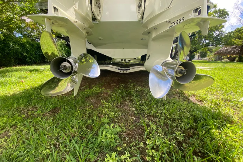 Slide: The Image of Rear view of 2005 Formula 280 Sun Sport boat propellers on grass. - 48