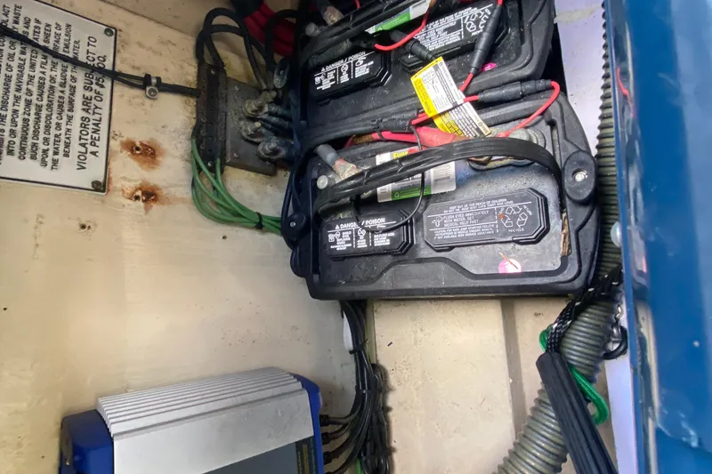 Slide: The Image of Battery compartment of a 2005 Formula 280 Sun Sport boat with wiring and labels. - 57