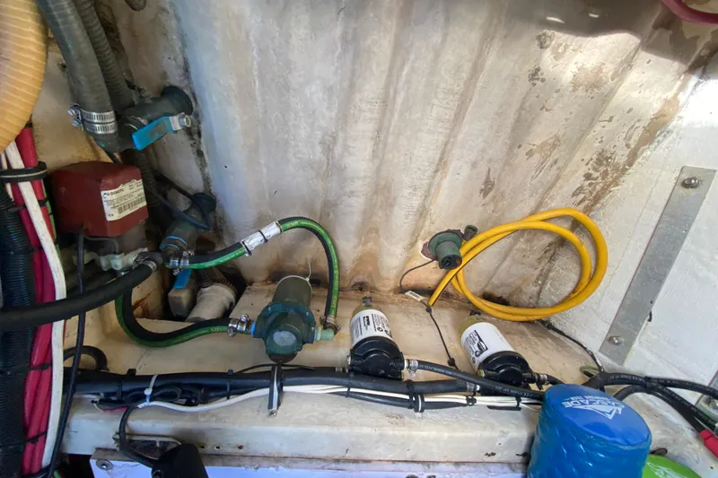 Slide: The Image of Engine compartment of 2005 Formula 280 Sun Sport with hoses and filters visible. - 58