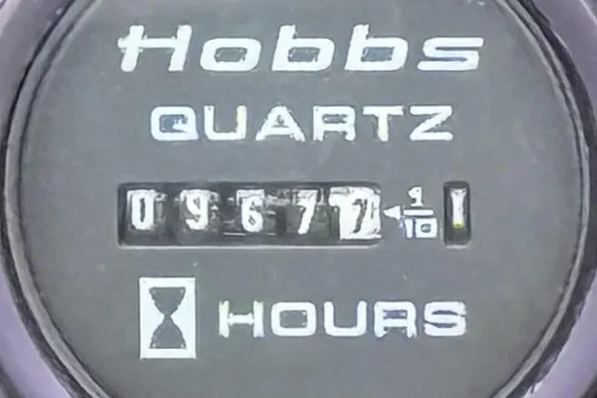 Slide: The Image of Hobbs Quartz hour meter displaying 9677.1 hours on a 1978 Marine Trader Europa. - 35