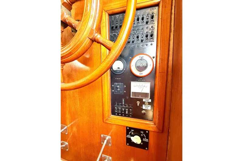 Slide: The Image of 1978 Marine Trader Europa helm with wooden wheel and control panel. - 5