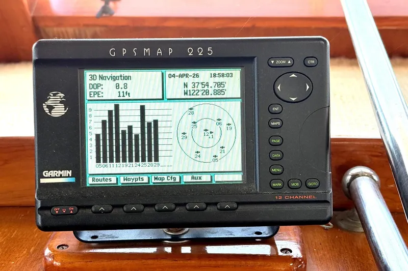 Slide: The Image of Garmin GPSMAP 225 on 1978 Marine Trader Europa, displaying navigation data and coordinates. - 7