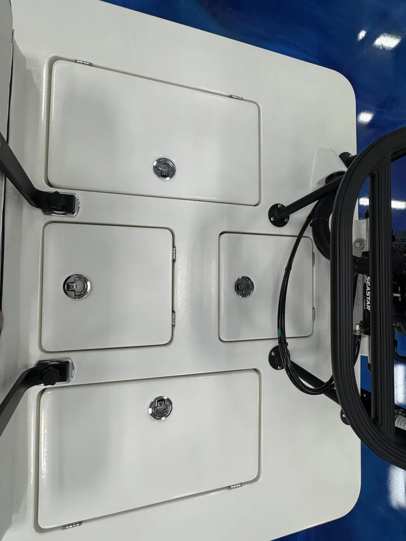 Slide: The Image of Maverick HPX-S 2026 boat deck with storage hatches and steering. - 16