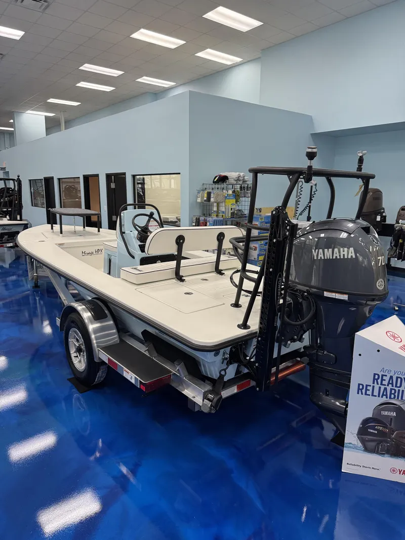 Slide: The Image of Maverick HPX-S 2026 boat with Yamaha engine in showroom. - 24
