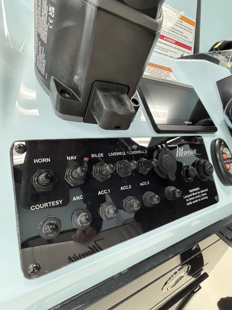 Slide: The Image of Maverick HPX-S 2026 boat control panel with switches and displays. - 29