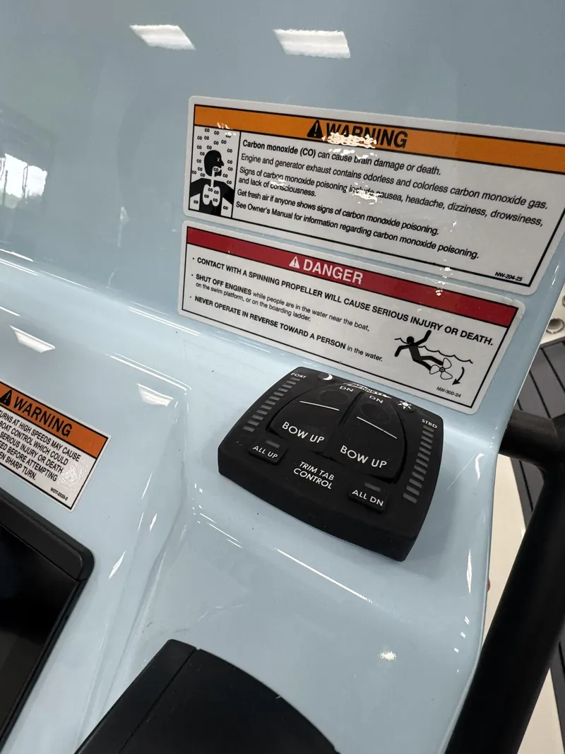 Slide: The Image of Maverick HPX-S 2026 control panel with warning labels and trim tab control. - 31