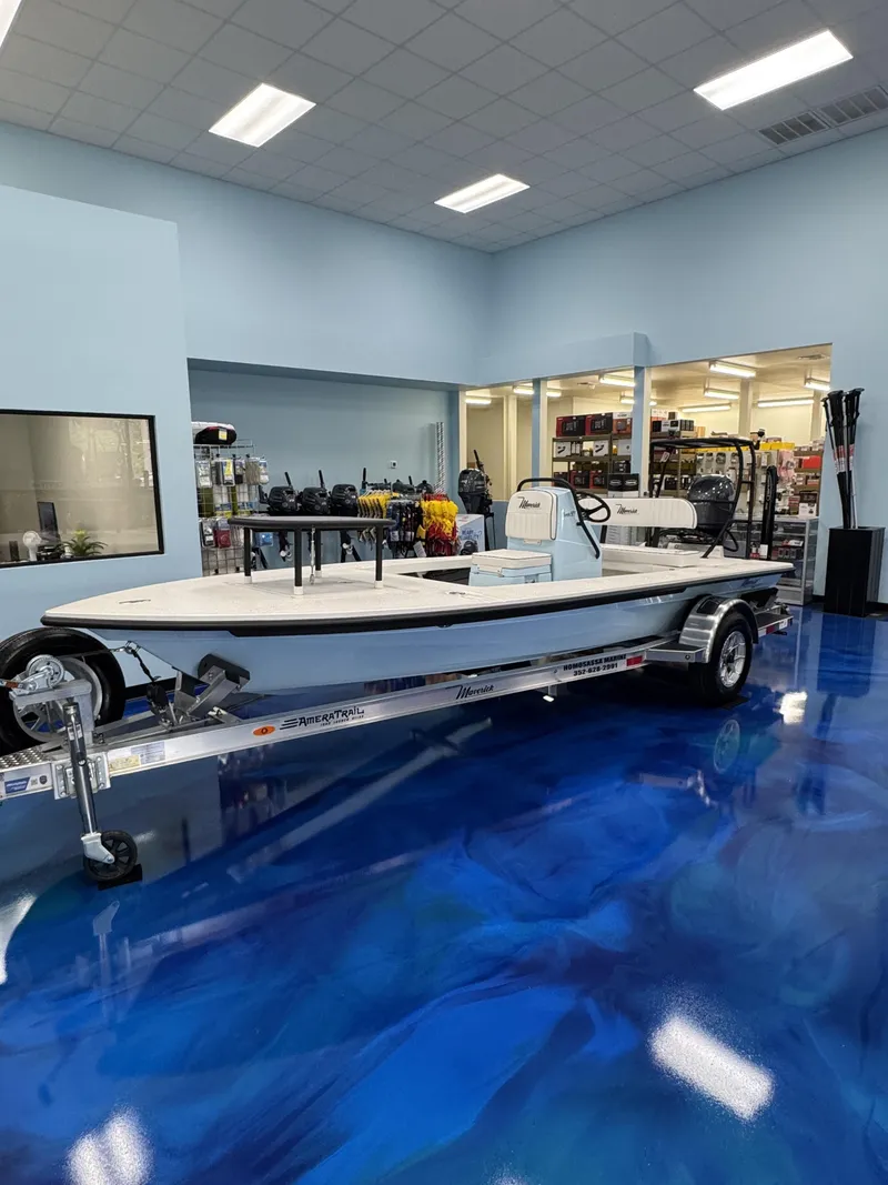 Slide: The Image of 2026 Maverick HPX-S boat in showroom on trailer. - 9
