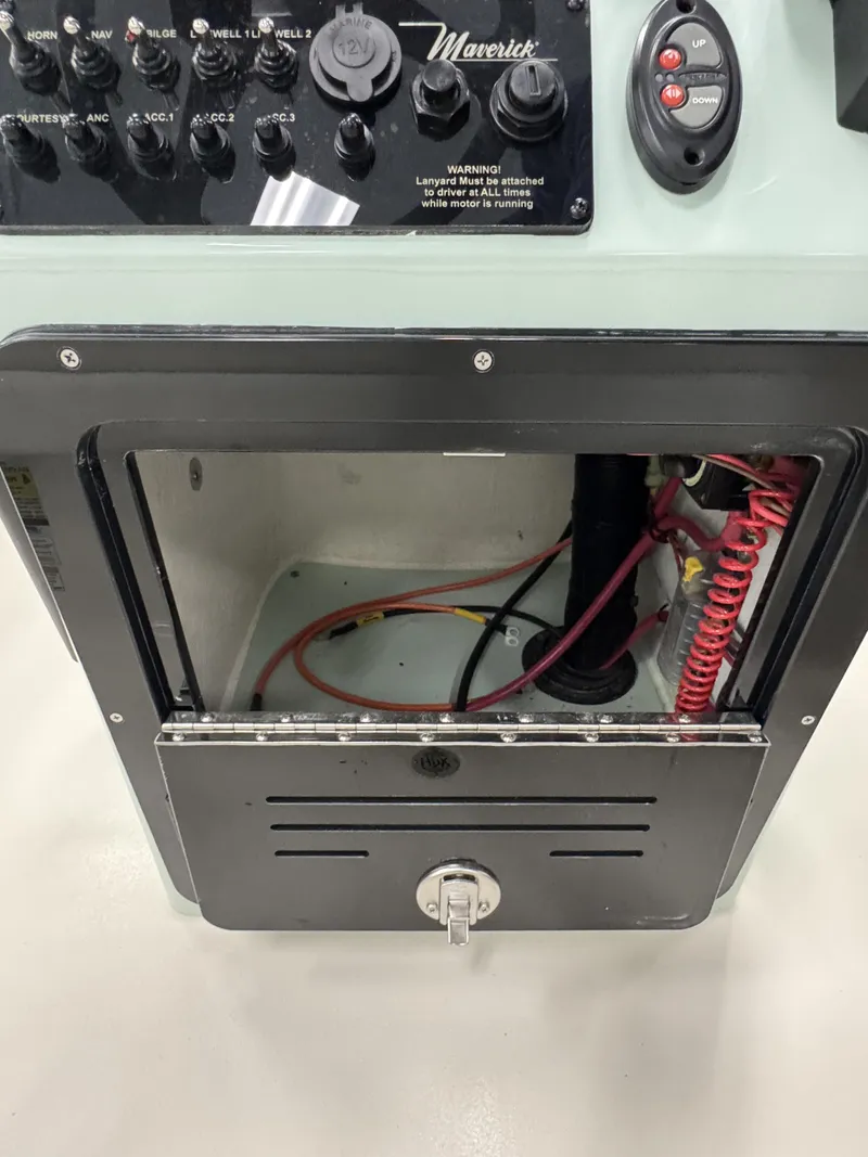 Slide: The Image of Maverick HPX-V 2026 control panel with switches and wiring. - 12