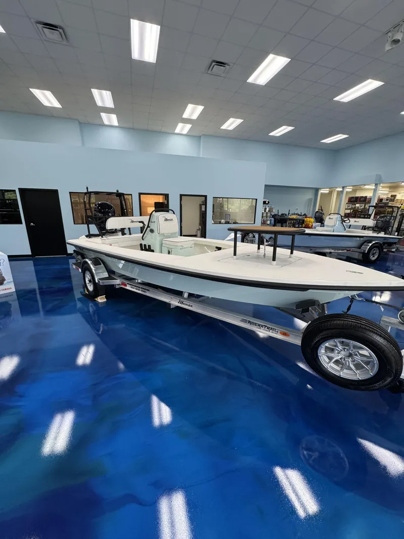 Slide: The Image of Maverick HPX-V 2026 boat in showroom with blue floor. - 21