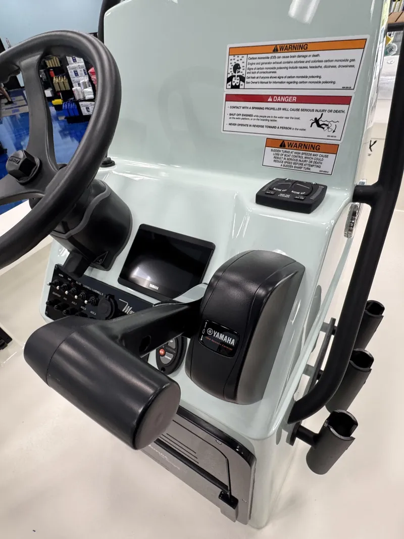 Slide: The Image of Maverick HPX-V 2026 console with Yamaha controls and warning labels. - 26