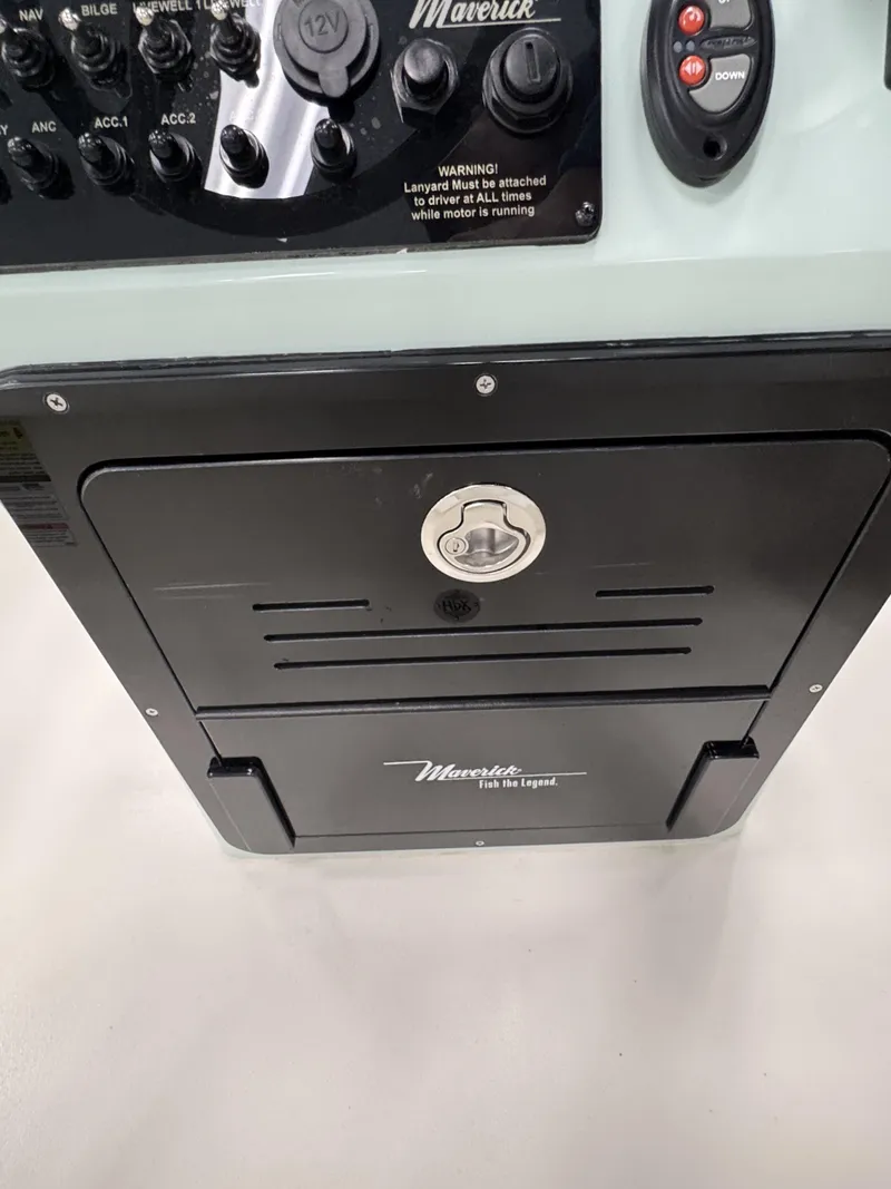 Slide: The Image of Maverick HPX-V 2026 control panel with switches and warning label. - 27