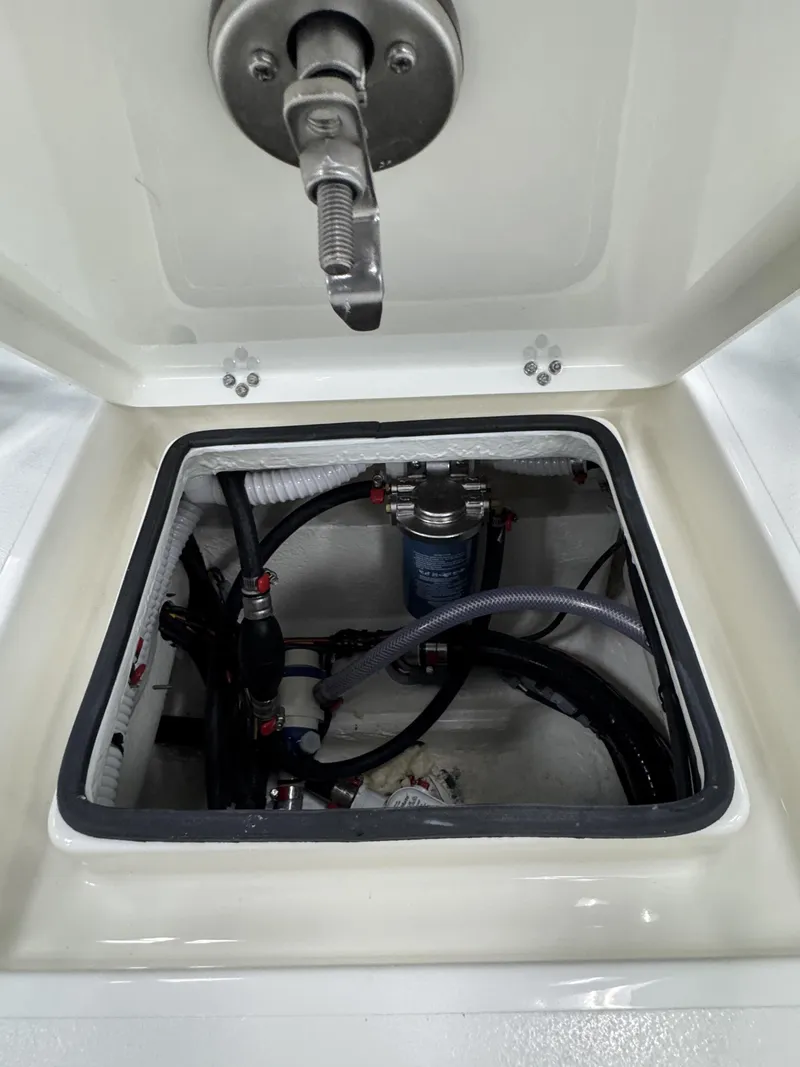 Slide: The Image of Maverick HPX-V 2026 boat compartment with hoses and valves. - 32