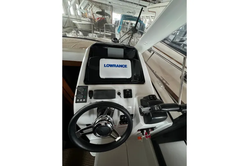 Slide: The Image of Helm of 2016 Jeanneau Merry Fisher 855 with Lowrance navigation system. - 16