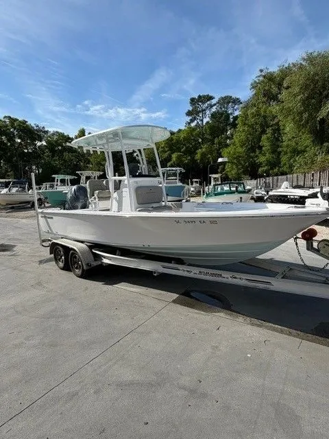 The Image of 2022 Sportsman Masters 227 Bay Boat on trailer at marina. - 1