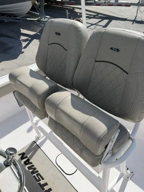 Slide: The Image of Sportsman Masters 227 Bay Boat 2022, cushioned seats in sunlight. - 11