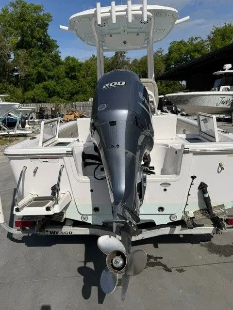 Slide: The Image of Rear view of a 2022 Sportsman Masters 227 Bay Boat with outboard motor. - 14