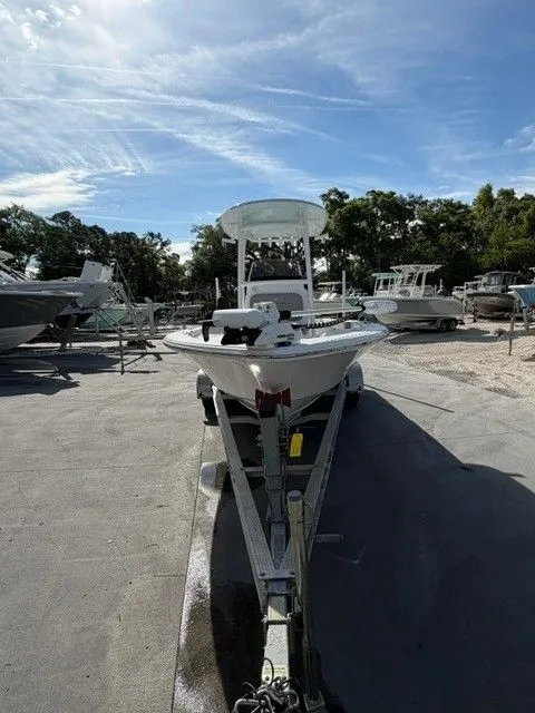 Slide: The Image of 2022 Sportsman Masters 227 Bay Boat on a trailer outdoors. - 16