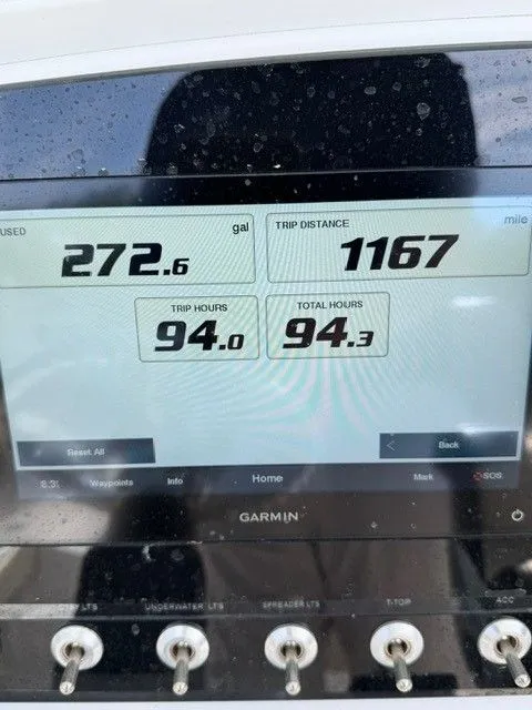 Slide: The Image of Garmin display on Sportsman Masters 227 Bay Boat, 2022, showing fuel usage and trip data. - 6