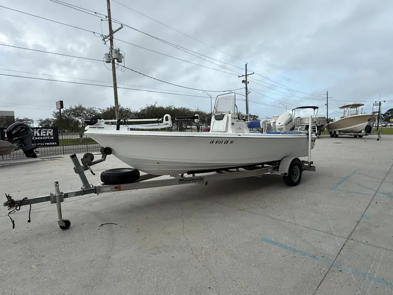 Slide: The Image of 2015 Blue Wave 2000 PureBay boat on trailer outdoors. - 10