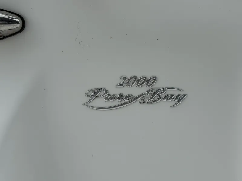 Slide: The Image of Close-up of 2015 Blue Wave 2000 PureBay boat emblem. - 11