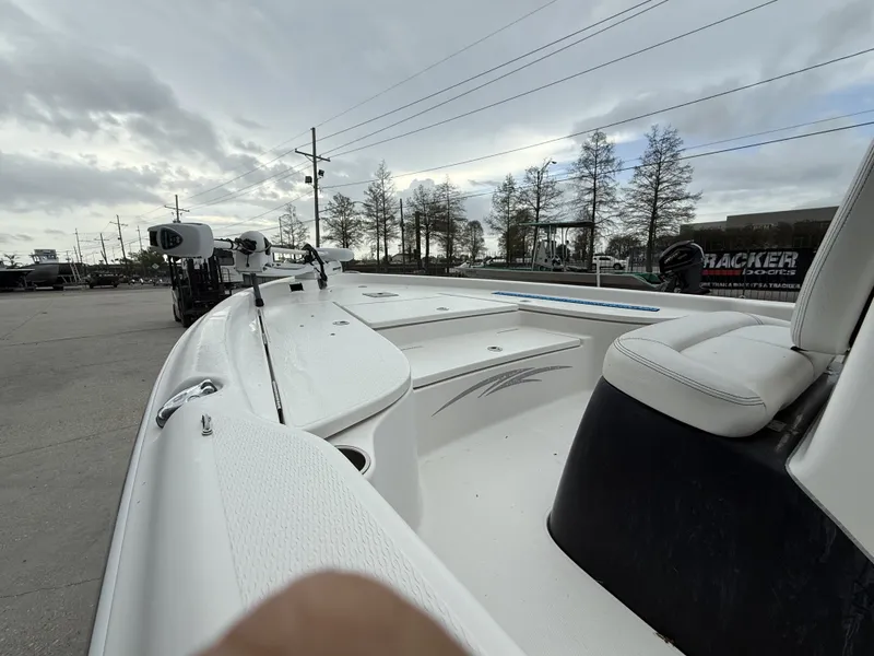 Slide: The Image of 2015 Blue Wave 2000 PureBay boat on parking lot under cloudy sky. - 14