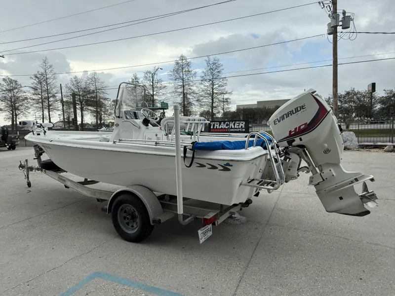 Slide: The Image of 2015 Blue Wave 2000 PureBay boat on trailer with Evinrude motor. - 5