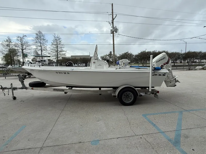 Slide: The Image of 2015 Blue Wave 2000 PureBay boat on trailer outdoors. - 6