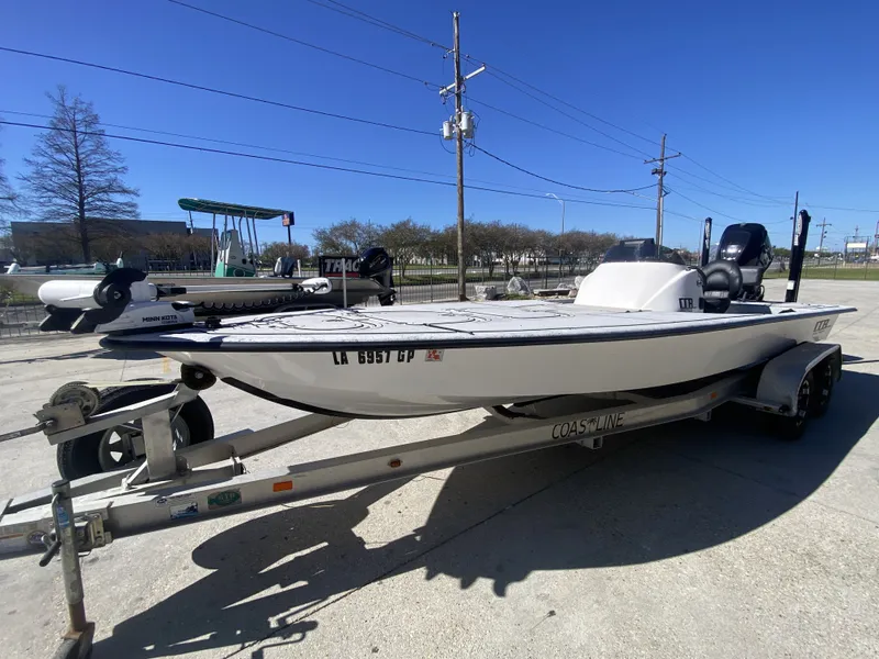 Slide: The Image of 2020 CCB Coastal Custom Boats 23' Fury on trailer, sunny day. - 4