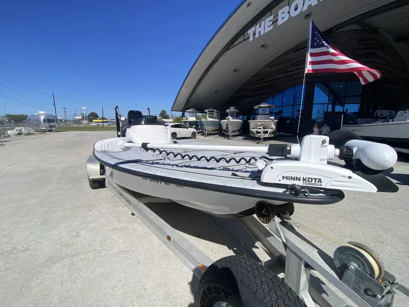 Slide: The Image of 2020 CCB Coastal Custom Boats 23' Fury in front of a boat dealership. - 6