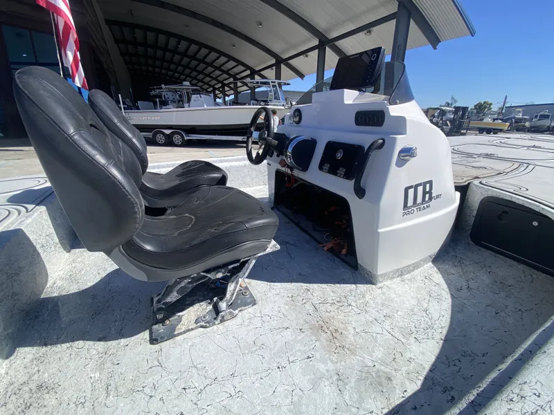 Slide: The Image of Interior view of a 2020 CCB 23' Fury boat with steering console. - 7