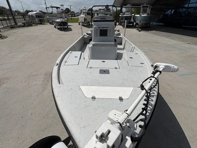 Slide: The Image of 2020 Blazer Bay 2170 boat displayed in a parking lot. - 17