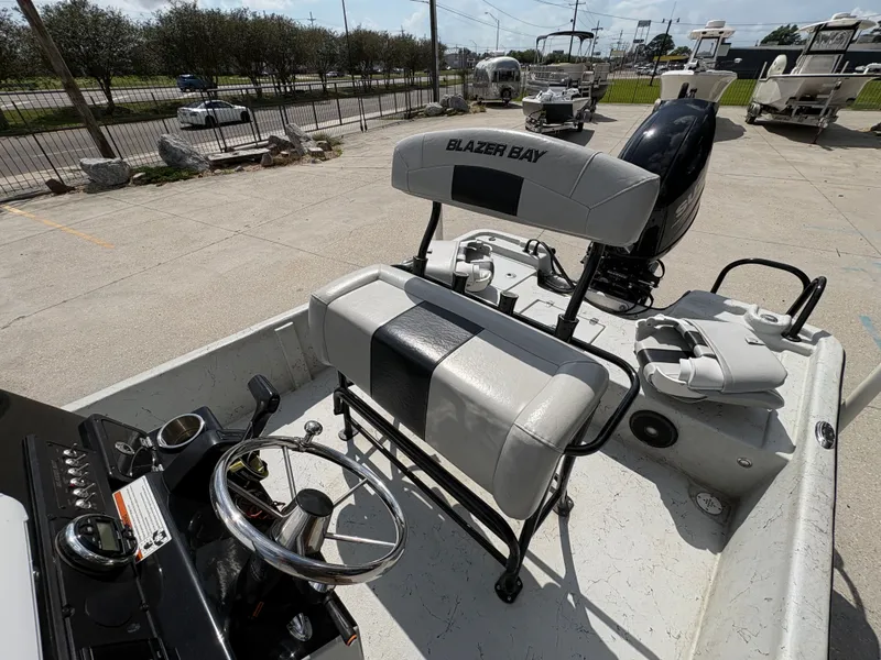 Slide: The Image of 2020 Blazer Bay 2170 boat with helm and seating area. - 21