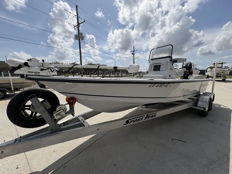 Slide: The Image of 2020 Blazer Bay 2170 boat on trailer under blue sky. - 4