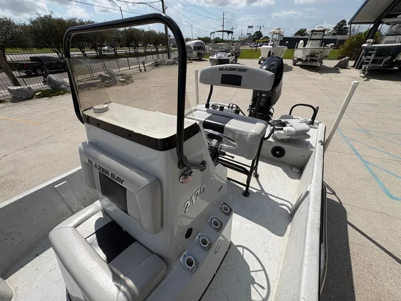 Slide: The Image of 2020 Blazer Bay 2170 boat parked outdoors on a sunny day. - 8