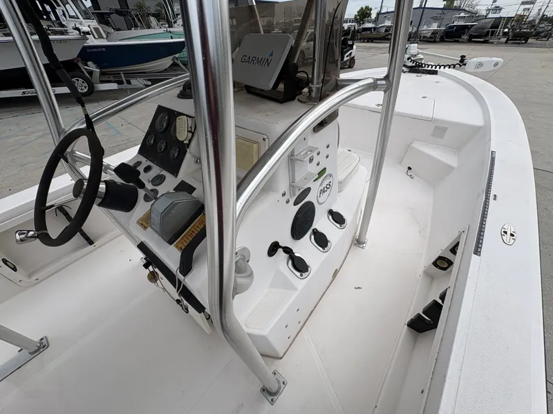 Slide: The Image of Interior view of a 2000 Kenner 21 CC boat with steering console. - 13