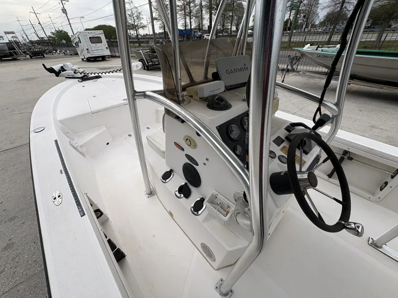 Slide: The Image of Interior view of a 2000 Kenner 21 CC boat with steering console. - 14
