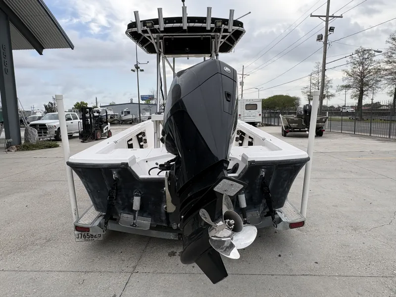 Slide: The Image of Rear view of a 2000 Kenner 21 CC boat with outboard motor. - 16