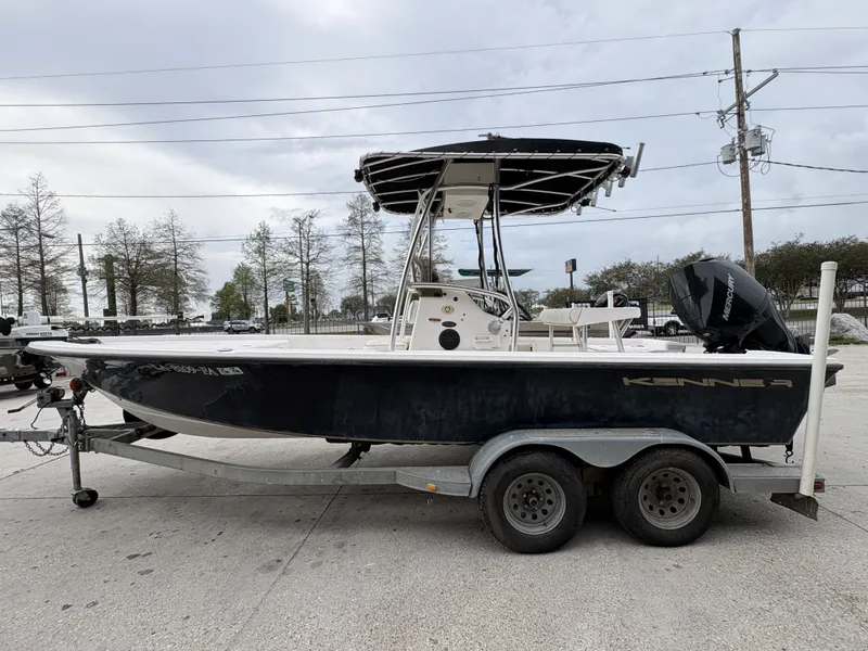 Slide: The Image of 2000 Kenner 21 CC boat on trailer, side view. - 17