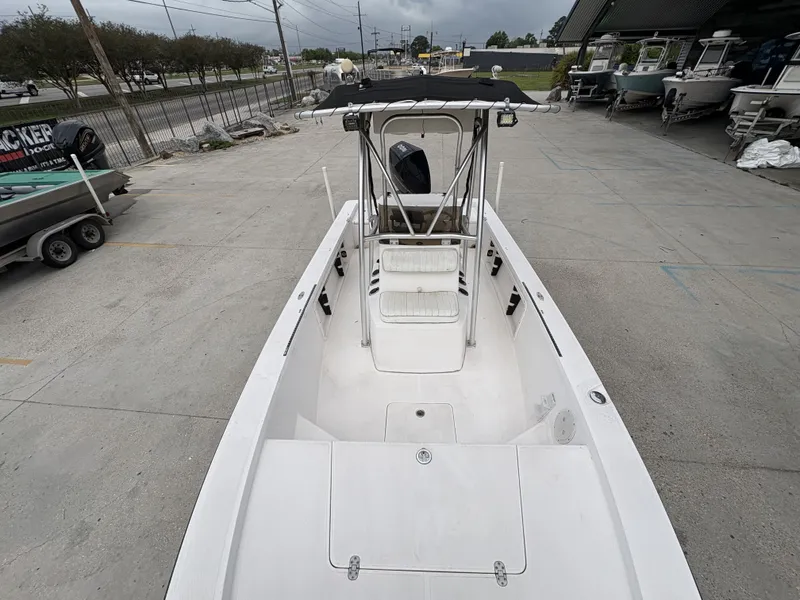 Slide: The Image of Kenner 21 CC boat from 2000 on a parking lot. - 19