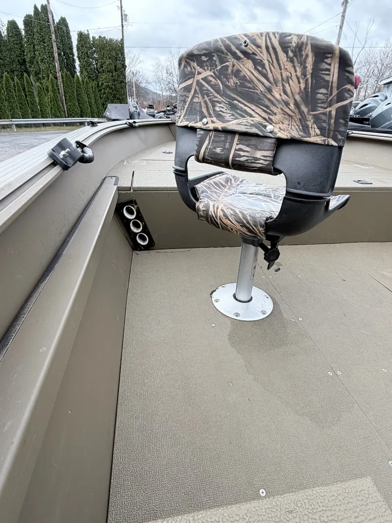 Slide: The Image of 2020 G3 Outfitter V177 T boat with camo-patterned seat. - 16