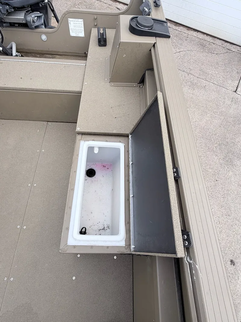 Slide: The Image of 2020 G3 Outfitter V177 T boat with open storage compartment. - 26