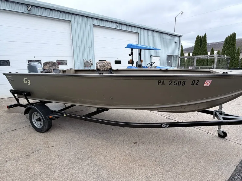 Slide: The Image of 2020 G3 Outfitter V177 T boat on trailer in front of garage. - 29