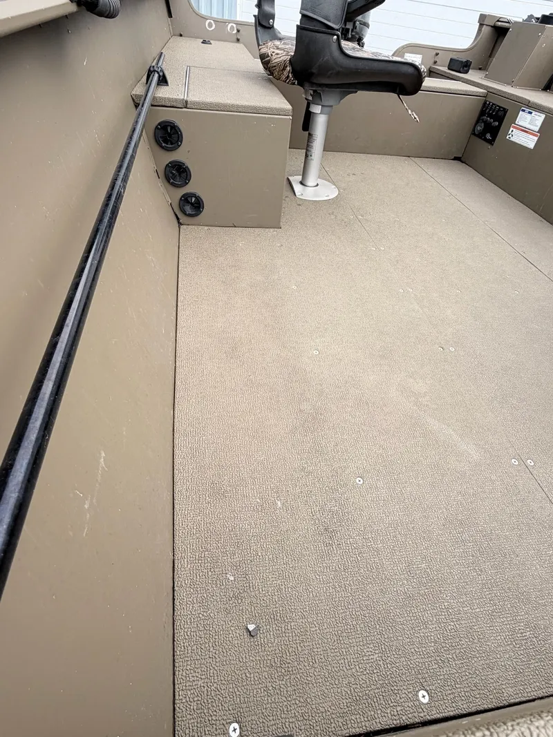 Slide: The Image of Interior of 2020 G3 Outfitter V177 T boat with seat and storage. - 30
